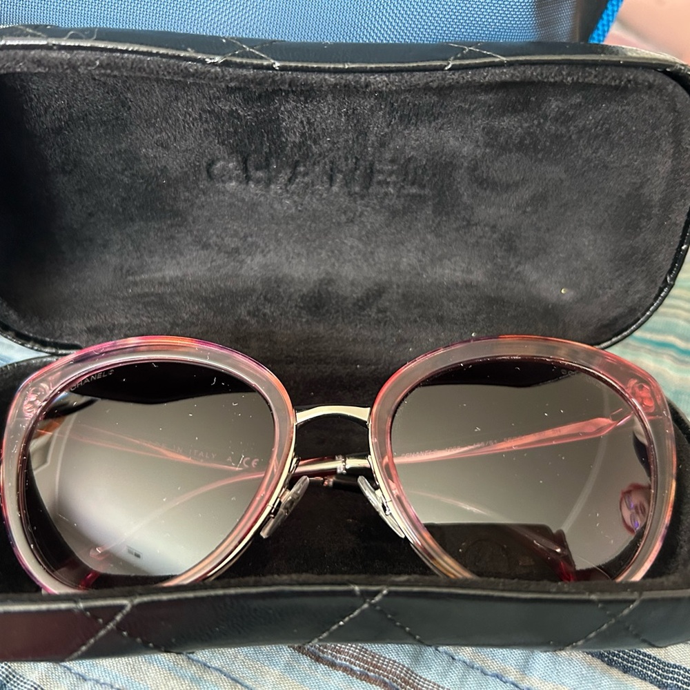 Authentic Chanel sunglasses with a lovely rose tinted frame. Original case.